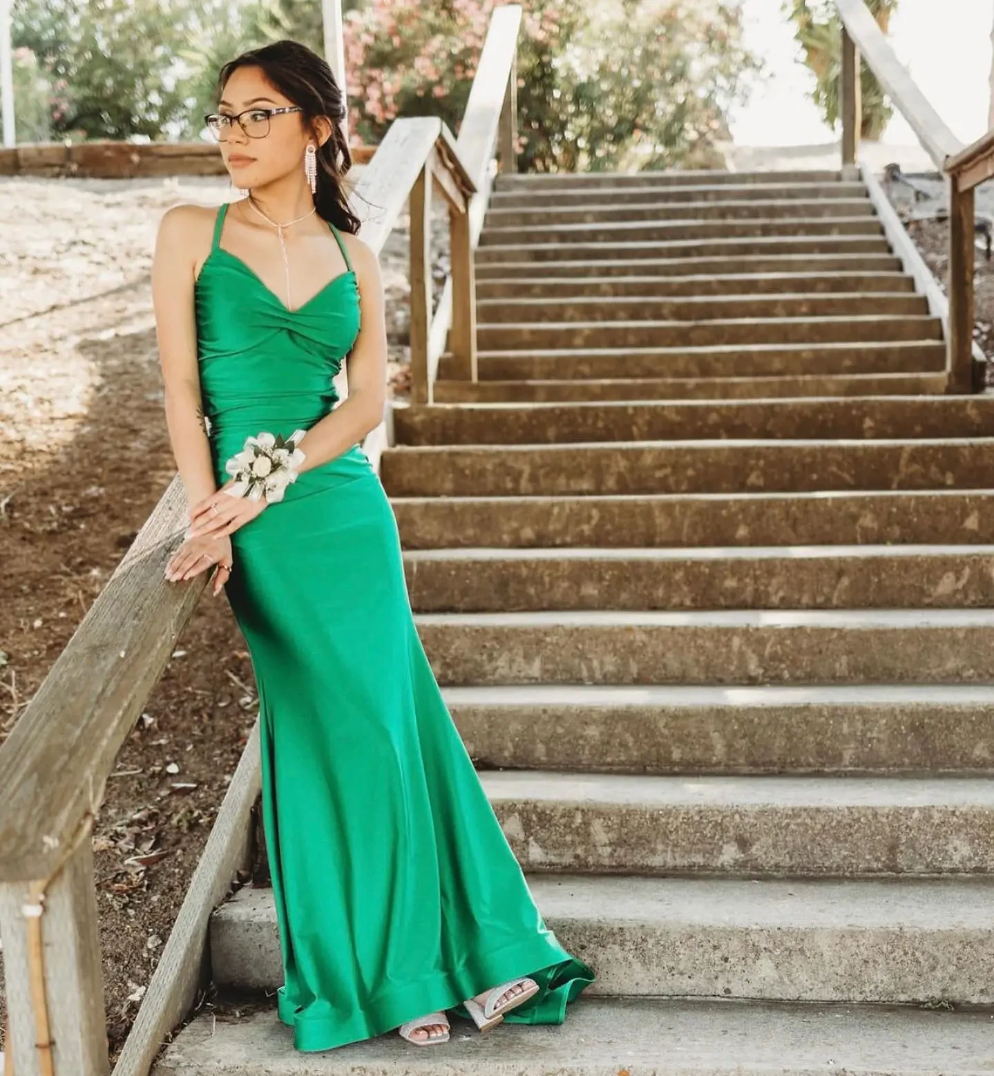 Model wearing a green dress on the steps