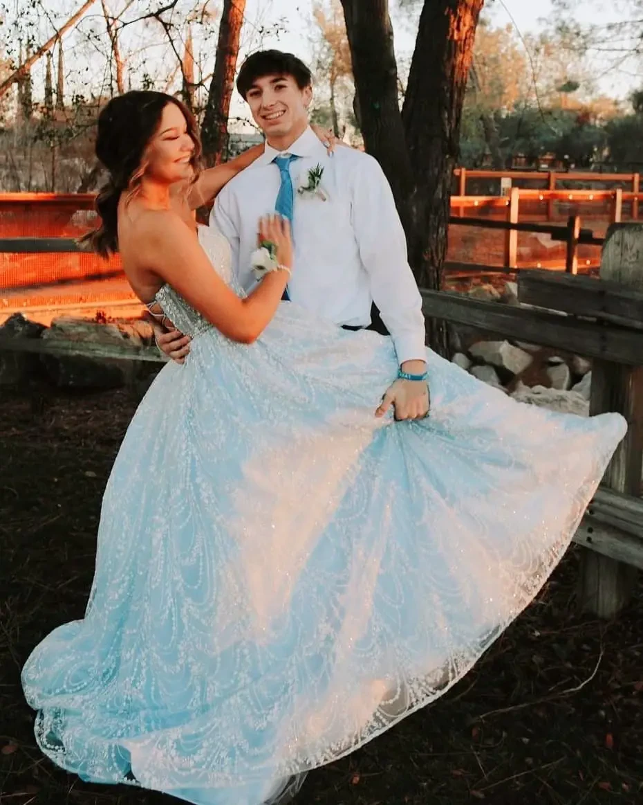 Сouple wearing a white gown and a white suit