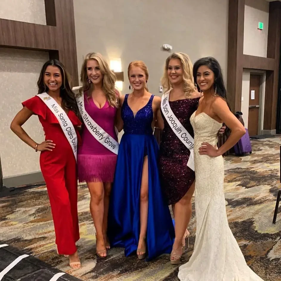 Models wearing a color gowns in the hall